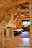Interior, vertical, master bedroom suite in loft, Gilchrist residence, Monterey, Tennessee, Honest Abe Log Homes