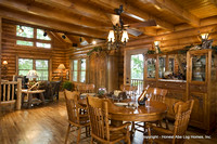 Interior, horizontal dining room looking into living room, Alderson residence, Clinton, Arkansas, Honest Abe Log Homes