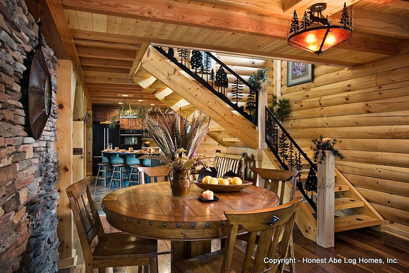 Interior, horizontal, entry area toward kitchen and stairway with stamped iron railing, Wilson residence, Crossville, Tennessee; Honest Abe Log Homes