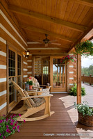 Exterior, vertical, rear porch with rocking chairs, DeSocio residence, Henry, Tennessee, Honest Abe Log Homes