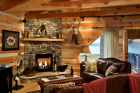 Interior, horizontal, game room sitting area toward fireplace, DeSocio residence, Paris, Tennessee; Honest Abe Log Homes